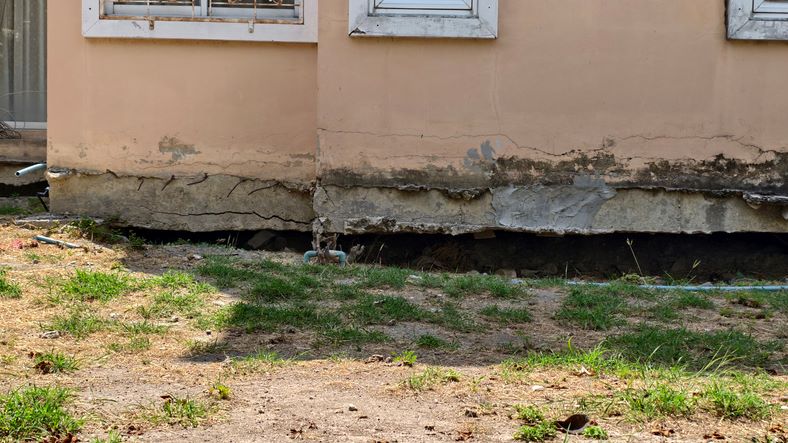 Cracked house foundation with visible damage in Dallas, TX